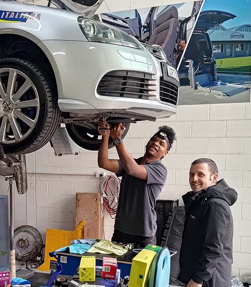 Chris and Ross working on a car