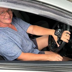 Tonya shown using her new hand controls that enable her to drive with neuropathy